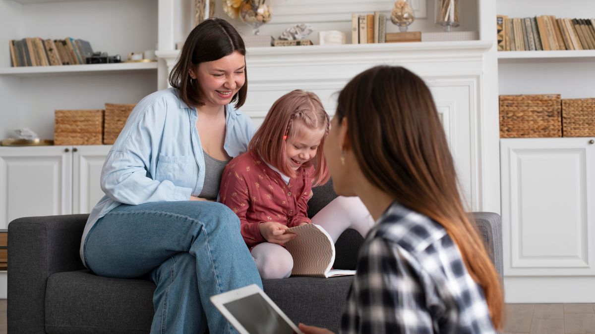 A young girl with autism receiving therapy, guided by her parents and a therapist, in a friendly and positive interaction.